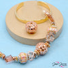 Inspired by Peach Fuzz, Pantone's color of the year, reimagined with Jesse James Beads