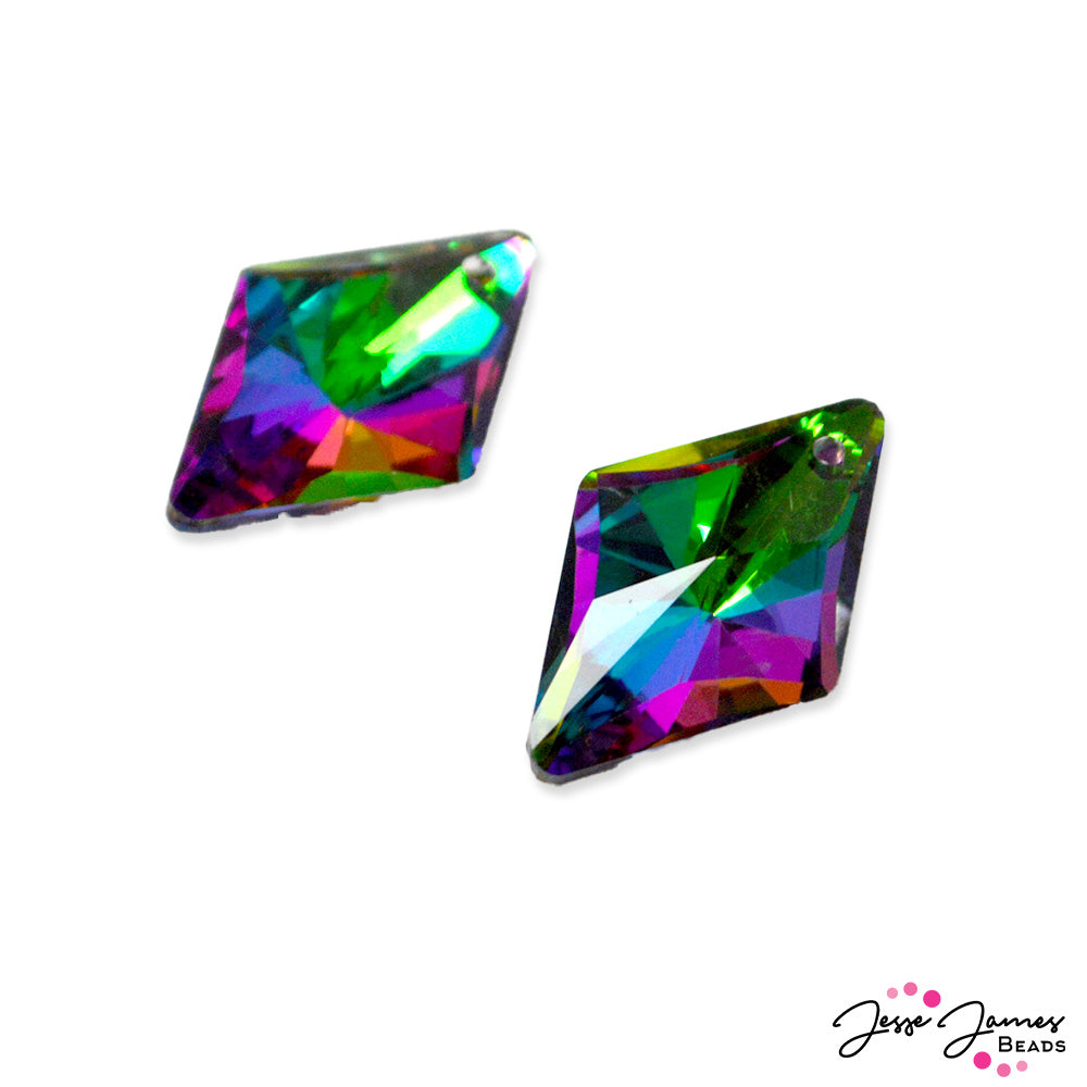 Dive into murky waters and discover mysterious treasures. These faceted glass pendants feature a unique blend of purple, pink, blue, and green. Measures 23mm x 14.5mm x 7mm. Sold in 2 pendants per order.