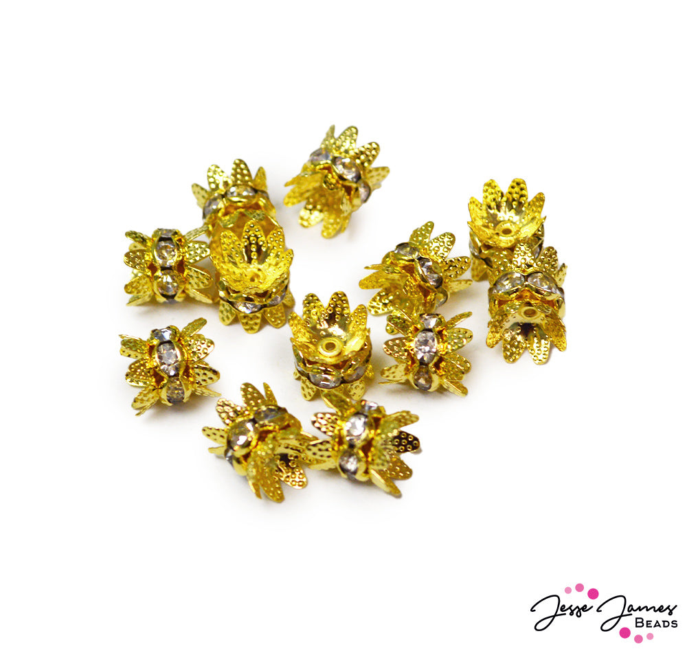 The perfect spacers for all your beads. These bright gold metal beads are decorated with an elegant pattern and crystal rhinestones. 12 pieces per set. Each piece measures 10.4mm X 7mm. 
