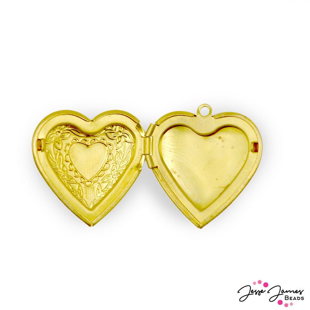 This lightweight brass locket features a beautiful floral engraving on the front. Open up this heart to add your favorite memories! The locket can hold heart-shaped cutout images 20mm x 20mm in size. Each locket measures 30mm x 28mm x 6mm. Inner bail measures 1.5mm. Sold idividually.