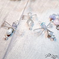 Wire-Wrapped angel pendants using Color Trends Bead Mix in Unicorn Bliss. Tutorial by Jem Hawkes.