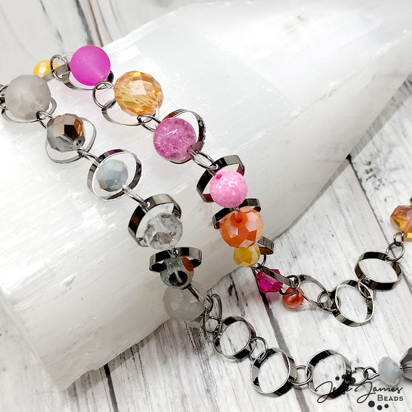 Create layered beaded bracelets by combining large link chain with Color Trends bead mix in Smoke & Mirrors.