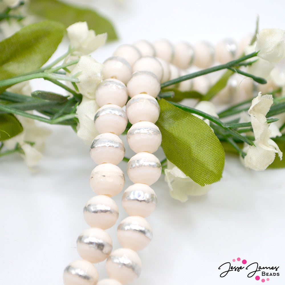 Let your inner beauty shine through. Each of these creamy opaque bead features a bright silver stripe, making them truly stand-out beads. Approx. 72 beads per strand. Beads measure 8mm. 